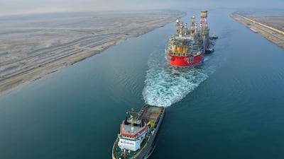 A tug pulls an Energean floating production and storage ship along Egypt's Suez Canal in June. The arrival of a gas production vessel owned by the company has escalated a territorial dispute between Lebanon and Israel. AFP