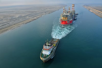 A tugboat pulls an Energean ship along Egypt's Suez Canal. Photo: AFP