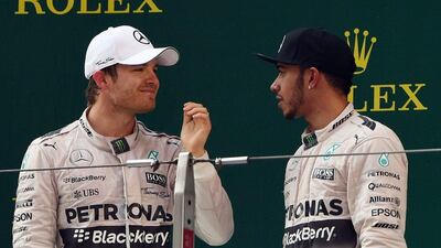 Mercedes drivers Nico Rosberg, left, and Lewis Hamilton after the Chinese Grand Prix. Greg Baker / AFP