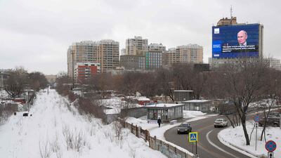 An electronic screen in Moscow displays an image of Russian President Vladimir Putin as he outlines the achievements of Russia last year. AFP