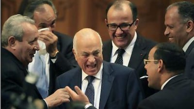 Egyptian foreign minister Nabil Elaraby, centre, laughs as he is surrounded by delegates at the Arab League headquarters in Cairo. After a last minute change of candidates, Mr Elaraby was elected the new secretary-general of the Arab League. Amr Nabil / AP Photo/