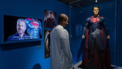 A visitor at the Art of DC exhibition at Yas Mall in Abu Dhabi. Courtesy Yas Mall