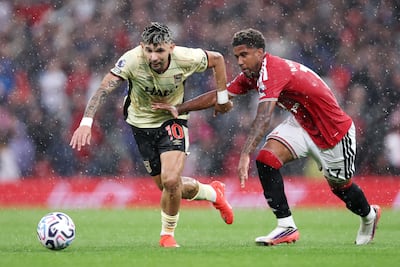 Julio Enciso of Ipswich Town, left, in action against Man United. Getty Images