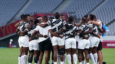 Fiji players celebrate victory.