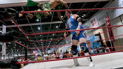 Crytpid flies at Rich 'N' Famous during a Dubai Pro Wrestling match. Reem Mohammed / The National