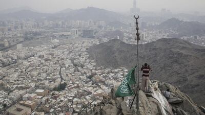 A Muslim man prays near the Hira cave at the Mount Al-Noor ahead of Haj at Mecca, Saudi Arabia. EPA