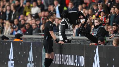 Referee Danny Makkelie checks the VAR screen and awards a penalty to Germany. Getty