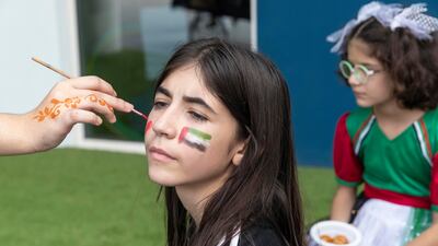 A pupil gets her face painted at Bloom World Academy. Antonie Robertson/The National