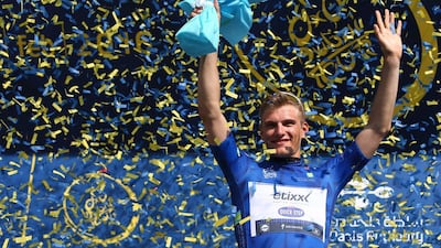 German cyclist Marcel Kittel of Etixx-Quick-Step salutes from the podium after winning the first stage of the Dubai Tour on Wednesday. Marwan Naamani / AFP / February 3, 2016