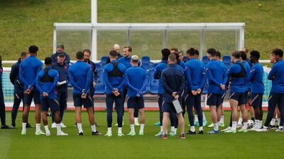 England players and the coaching staff during training.