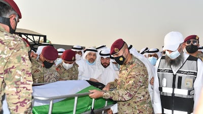Officials, mask-clad due to the COVID-19 coronavirus pandemic, carrying the bier of the late emir Sheikh Sabah al-Ahmad Al-Sabah upon its arrival for burial at the Sulaibikhat Cemetery. AFP