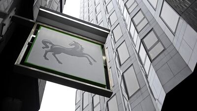 A sign hangs outside a Lloyds Bank branch in London. Barclays paid Lloyds about £4bn for the loans. Toby Melville / Reuters