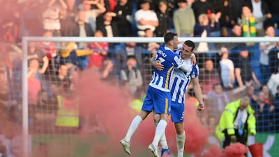 Pascal Gross and Lewis Dunk of Brighton & Hove Albion celebrate their win over Manchester United at American Express Community Stadium on Saturday, May 07, 2022. Getty