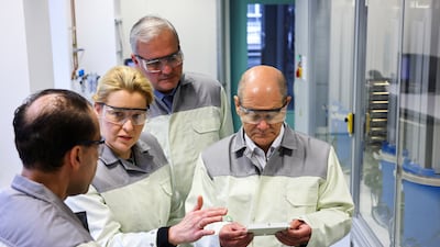 Olaf Scholz, right, joined Berlin mayor Franziska Giffey, second left, on the campaign trail at a science lab. Reuters