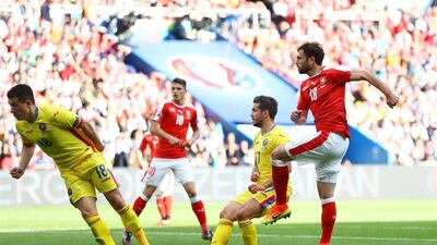 Admir Mehmedi scores Switzerland's equaliser against Romania. Clive Mason / Getty Images