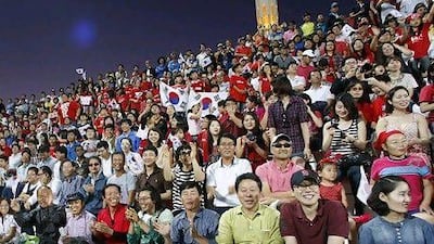 South Korean fans attend a World Cup qualifier in Dubai. Growing trade links with the UAE has led to 7,000 South Koreans taking up residence in the Emirates. Mike Young / The National