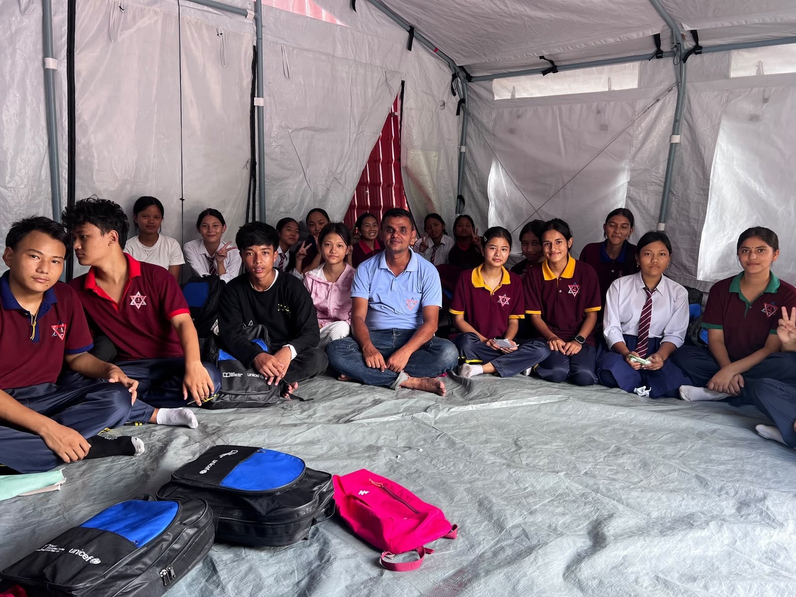 Pupils remember the computer and science laboratories in their old school washed away in the floods but are grateful that classes have begun in a temporary facility. Photo: Rajendra Dawadi