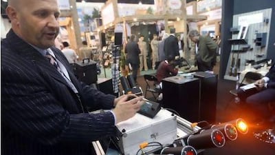 Newco safety technologies's Christian Tatarzycki shows off a rocket system that can be place in a car to help provide security. Sammy Dallal / The National