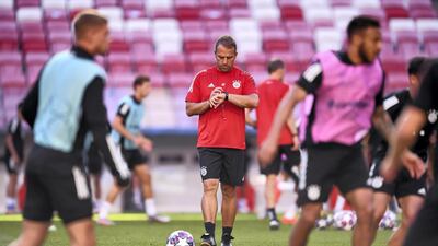 Hansi Flick, Bayern coach, checks on his players. Getty