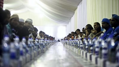 Thousands gathered at the Sheikh Zayed Grand Mosque to receive their complimentary Iftar on the first night of Ramadan. June 18, 2015. Lee Hoagland/The National.