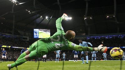 Yaya Toure shoots and scores a penalty past Everton keeper Tim Howard in Manchester City's 1-0 Premier League victory at the Etihad Stadium on Saturday. Darren Staples / Reuters