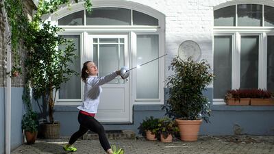German sabre fencer Anna Limbach trains in her backyard in Cologne, Germany. Getty