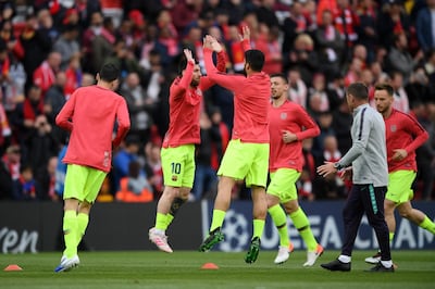 Lionel Messi and Luis Suarez of Barcelona warm up prior at Anfield. Getty Images