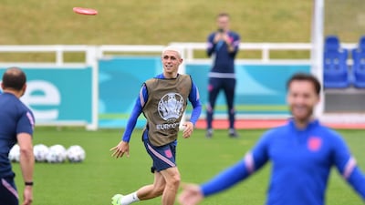England's midfielder Phil Foden plays frisbee during training on Thursday, June 17, ahead of the Euro 2020 match against Scotland. AFP