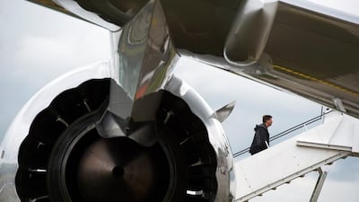 A man walks up the staircase to a Boeing 787 Dreamliner aircraft at the Farnborough International Airshow, which takes place this month. Adrian Dennis / AFP