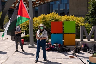 A protester holds a Palestinian flag at the Microsoft Campus in Redmond, Washington, on August 19. Bloomberg