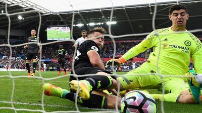 SWANSEA, WALES - SEPTEMBER 11: Chelsea goalkeeper Thibaut Courtois and Gary Cahill (r) fail to stop the second Swansea goal scored by Leroy Fer (not pictured) during the Premier League match between Swansea City and Chelsea at Liberty Stadium on September 11, 2016 in Swansea, Wales. (Photo by Stu Forster/Getty Images)