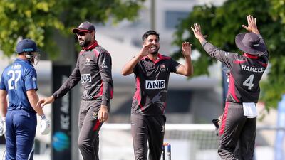 Junaid Siddique, centre, is only three ODIs into his UAE career but is already viewed as the side's senior bowler. Pawan Singh / The National