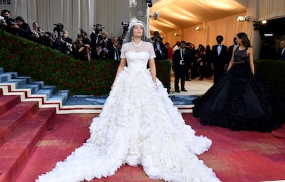 Dressed in a wedding dress, T-shirt and baseball cap, Kylie Jenner at the 2022 Met Gala In America: An Anthology of Fashion. AFP