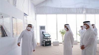 Sheikh Mohammed bin Rashid, together with Sheikh Mansour bin Zayed, view displays of the new developments.