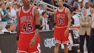 Chicago Bulls guard Michael Jordan and forward Scottie Pippen (33) walk back to the bench during a timeout in the closing seconds of an NBA basketball playoff game in 1995. AP