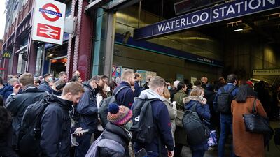 Commuters queue outside Waterloo station in London, as tube services remained disrupted on Wednesday morning. PA