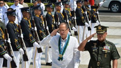 Philippine President Benigno Aquino at a distribution ceremony of M-4 assault rifles for soldiers at the Defense Department office in Manila. Aquino has said he may try to change the constitution and serve a second term in office, a stunning announcement in a nation haunted by dictatorship. TED ALJIBE / AFP
