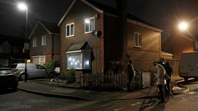 A television crew stands outside a house, after a drone was flown near Gatwick Airport, forcing the airport to close, in Crawley. Reuters