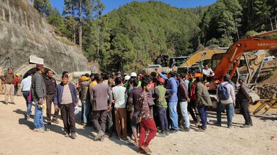Workers protest against the slow pace of the rescue after the tunnel collapse. AFP