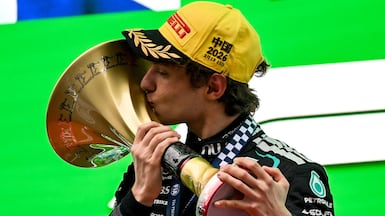 TOPSHOT - Winner Mercedes' Italian driver Kimi Antonelli celebrates on the podium after the Formula One Chinese Grand Prix at the Shanghai International Circuit in Shanghai on March 15, 2026. (Photo by JADE GAO / AFP)