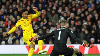Manchester United's David De Gea stops a shot from Liverpool's Raheem Sterling during their Premier League match on Sunday. Peter Powell / EPA