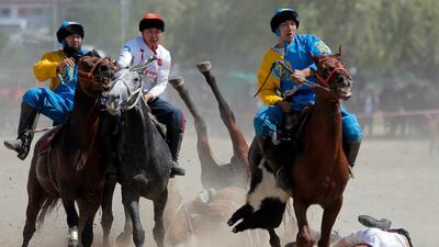 Kazakh and US horsemen take part in kok-boru. EPA