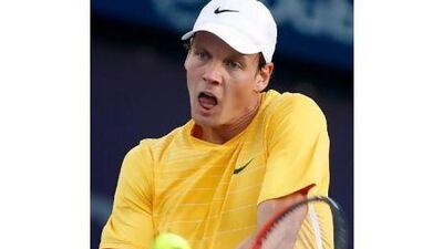 Tomas Berdych plays a shot during his win over Nikolay Davydenko in Dubai yesterday.