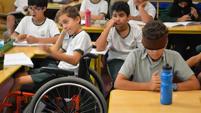 Pupils at Al Mushrif Primary School experienced a day wearing blindfolds, wheelchairs and ear muffs as they participated in the One World Many Abilities programme. Photo courtesy Al Mushrif Primary School