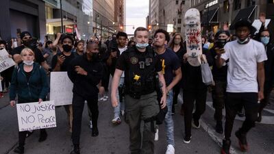 Violent protests erupted across the US over the death of George Floyd, a black man in police custody. AFP
