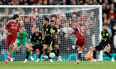 Liverpool's Alexis Mac Allister scores their second goal in a 2-1 win against Atletico Madrid. EPA