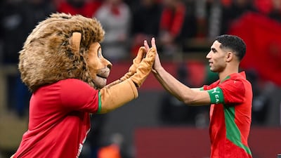Morocco defender Achraf Hakimi celebrates reaching the final of the Africa Cup of Nations, where his side will face Senegal. AFP
