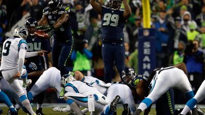 Graham Gano kicks for the Carolina Panthers against the Seattle Seahawks during the 2015 NFL play-offs. The kick above was blocked, but replayed after a roughing the kicker penalty. Otto Greule Jr / Getty Images / AFP