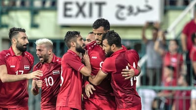 Syria players celebrate one of their four goals against Guam at Al Maktoum bin Rashid Stadium in Dubai on Tuesday. Antonie Robertson/The National
