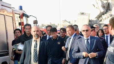 Italian Prime Minister Giuseppe Conte arrives to inspect the site of the collapsed Morandi Bridge. Reuters
